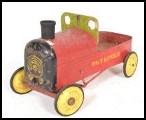 A vintage 20th Century Triang Duke Express pedal car / go kart in original painted finish with
