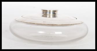 A silver hallmarked Art Deco 1920's dressing table powder puff having a silver lid with a mirror