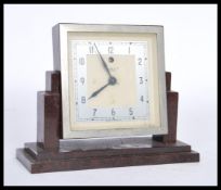A 1930's Art Deco mark V electric clock by Temco, having a white enamel dial with silver chapter