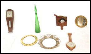 A collection of vintage 20th Century items to include three circular brass wall mirrors, two oak