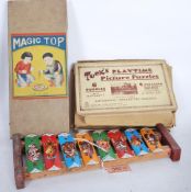 A selection of vintage mid 20th Century toy games to include Magic Top set of three enamelled