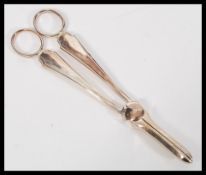 A pair of 20th Century hallmarked silver grape scissors by Frank Cobb & Co Ltd being hallmarked