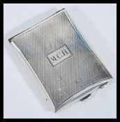 An early 20th Century hallmarked silver 1930's Art Deco vesta match case having engine turned