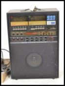 A vintage 20th Century Realistic Concertmate 2000 karaoke machine having dials to front complete