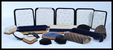 A collection of vintage shop display jewellery and ring stands to include padded ring stands and