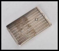 A vintage 20th century silver vesta case with engine turned decoration to the exterior and a sliding