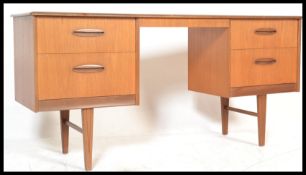 A retro 20th Century teak twin pedestal desk, having chamfered top. Both pedestal having two