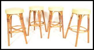 A set of four vintage retro 20th Century bar stool by Angraves of Leicester with rattan / wicker