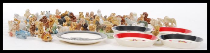 A good collection of Wade Whimsies figurines and ceramics to include a set of four playing card