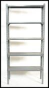 A 20th century Industrial manner metal shelf - rack of upright form with multiple shelves and in