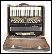 A vintage early 20th Century cased German made Regal Standard accordion