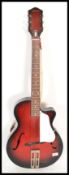 A vintage 20th Century 1950's Egmona six string guitar musical instrument having a flame sunburst