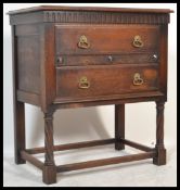 An Edwardian oak Jacobean revival chest of drawers