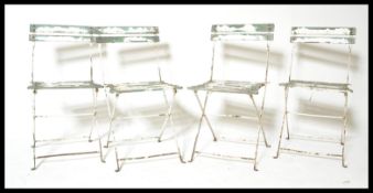 A set of four vintage retro 20th Century folding metal garden chairs of slatted signed having