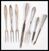 A selection of silver items to include a manicure set with silver hallmarked handles, a stamped