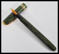 A vintage 20th Century Conway Stewart lever fill fountain pen having a 14ct gold nib complete in