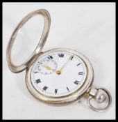 A 20th Century silver open face pocket watch having a white enamelled face with roman numerals to