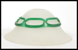 An early 20th Century leaded glass frosted lamp shade of conical mushroom shape having leaded