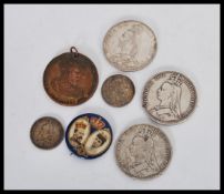 A group of Victorian coins comprising of a 1887 crown coin 2x 1889 crown, 1887 and 1902 one shilling
