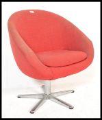 A retro 20th Century swivel tub chair, upholstered in a red fabric raised on a chrome upright with a