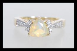 A hallmarked 9ct white gold ring set with a triang