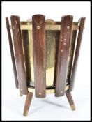 A 1960's retro vintage sputnik atomic teak wood and brass litter bin consisting of panelled teak