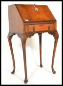 A 1930's Art Deco Queen Anne revival ladies walnut bonheur de jour / writing table desk. Raised on