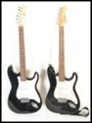 A 20th Century Rockburn six string acoustic guitar together with a CB Sky six string electric guitar