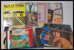 A collection of vinyl long play LP record albums to include Wu Tang Forever, Dire Straits, Frankie