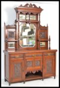 A 19th Century Victorian mirror back sideboard having a configuration of drawers and cupboards