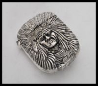 A silver plated vesta case having raised decoration of a native Indian to the front and back, having