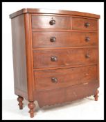 A 19th Century Victorian mahogany bow fronted chest of drawers raised on turned legs. Two bank of