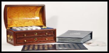 A collection of U.S State Quarters Series II, all contained within a folder. Each in a plastic