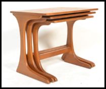 G-Plan - A set of three retro 20th Century teak wood tiled top nest of graduating tables raised on