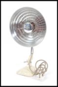 A vintage mid century Pifco heat lamp with UFO Space age style pendant shade raised on adjustable