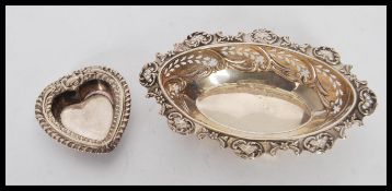 A silver hallmarked bon bon dish having scrolled decoration to the rim and pierced decoration to the