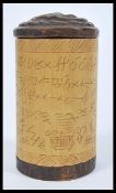 An early 20th Century Aboriginal tribal hand carved wooden cylindrical pot having Aboriginal