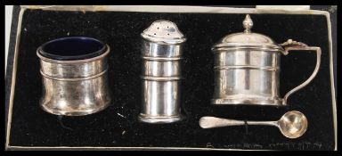 An early 20th Century Deakin & Francis silver hallmarked cruet set to include mustard pot, pepper