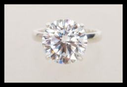 A stamped 925 silver dress ring set with a large cubic zirconia of approx 8ct's. Weight 5.8g. Size