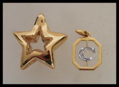 A stamped 750 18ct gold pendant in the form of a star (measures 1 inch) along with a stamped 750