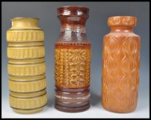 A group of three vintage retro 20th Century West German fat lava style pottery floor standing