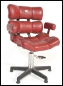 A vintage retro 20th century red fox leather adjustable armchair having five pints base and