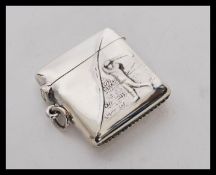 A stamped sterling silver vesta case embossed with the image of a golfer. Weight 15.4g. Measures 3 x