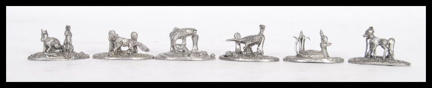 A boxed set of ' Silver Scenes ' pewter place card settings in the form of animals to include a