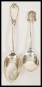 A 19th Century French silver table spoon having scrolled decoration to the handle along with a