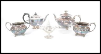 A group of silver plate to include a three piece tea service, additional teapot and silver plated