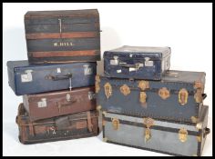 A collection of 20th century steamer trunks and suitcases dating to the early and middle part of the