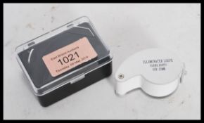 A cased jewellers loupe having an inbuilt LED light. 40x - 25mm.