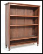 An Edwardian mahogany open window library bookcase cabinet. Raised on tapering supports with open