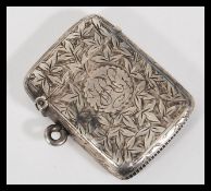 An early 20th Century Edwardian hallmarked silver vesta case makers JT. Chased leaf decoration